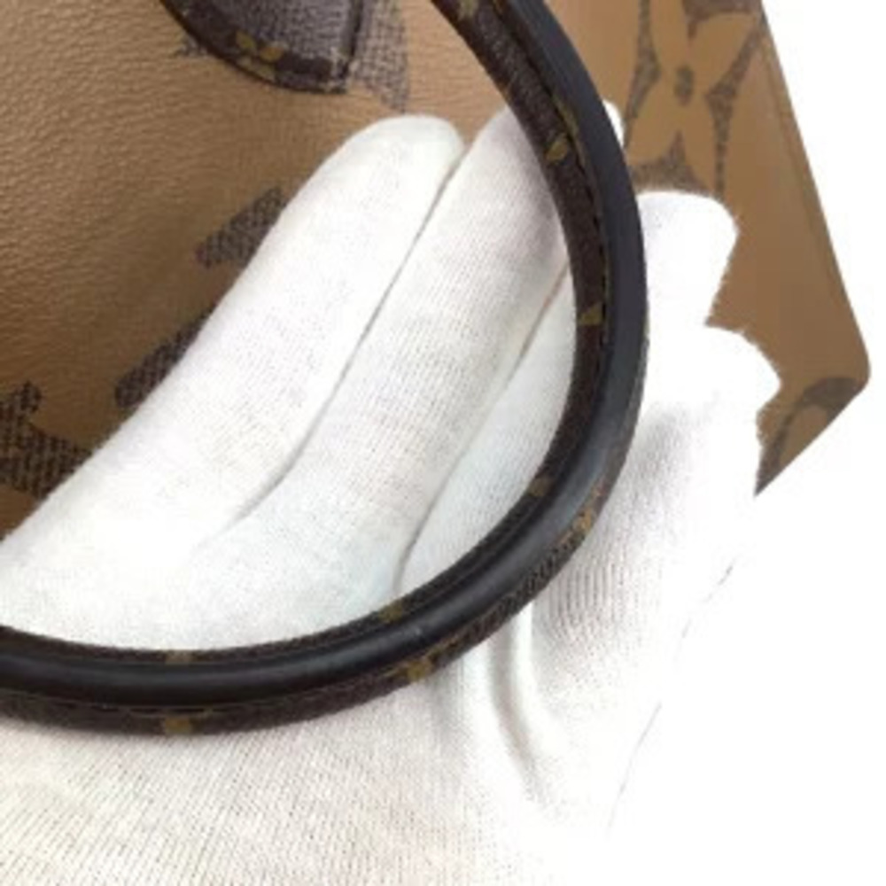 LOUIS VUITTON Monogram Reverse On The Go Brown Beige Cream